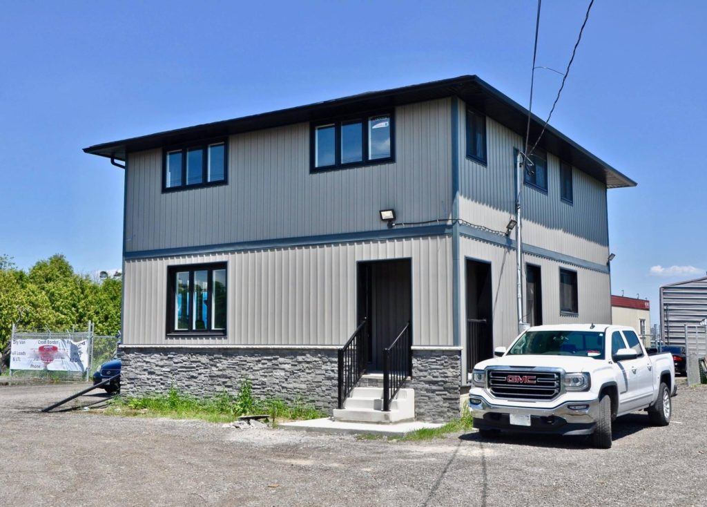 exterior of a two story home with blue and white siding